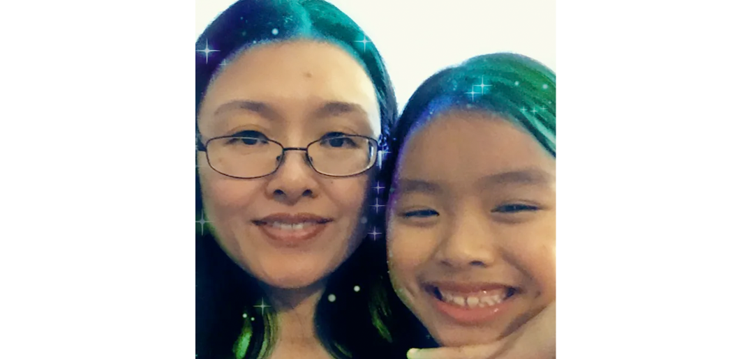 Edith and her daughter smiling at the camera with a blue and green filter on their hair. 