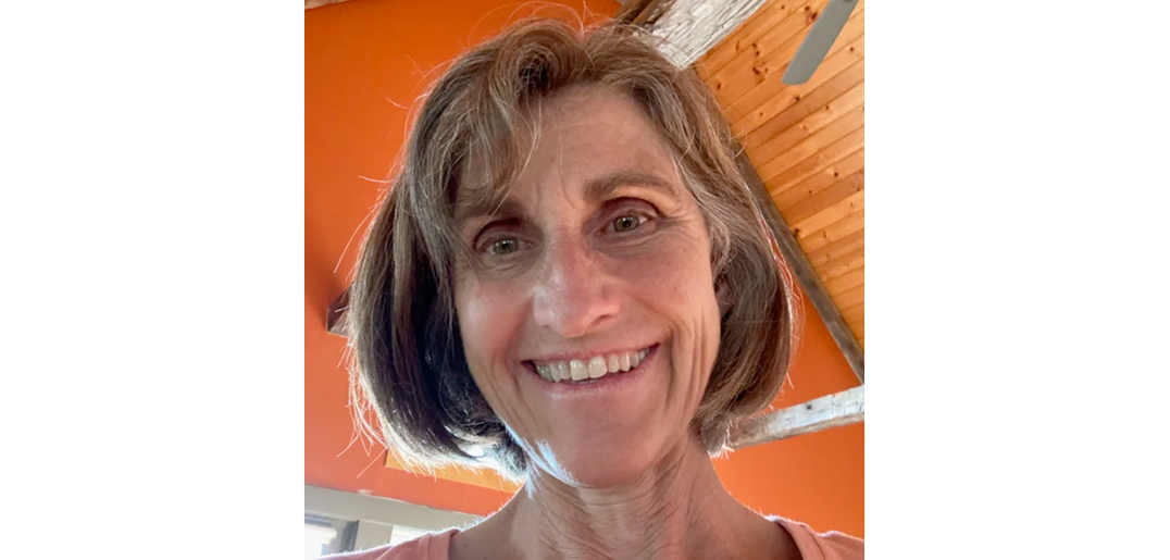 Headshot of Kim smiling