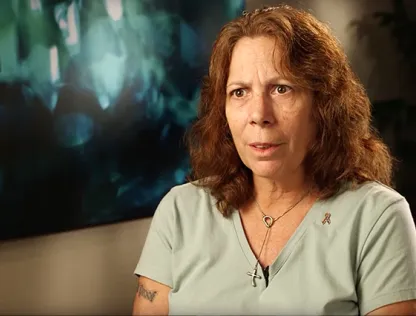 Nancy actively discussing in a sit-down interview